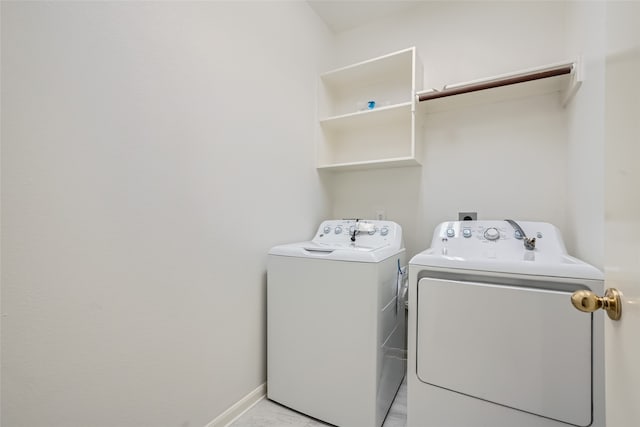 clothes washing area with washer and dryer