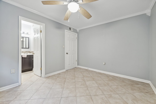 unfurnished bedroom with crown molding, light tile patterned floors, connected bathroom, and ceiling fan