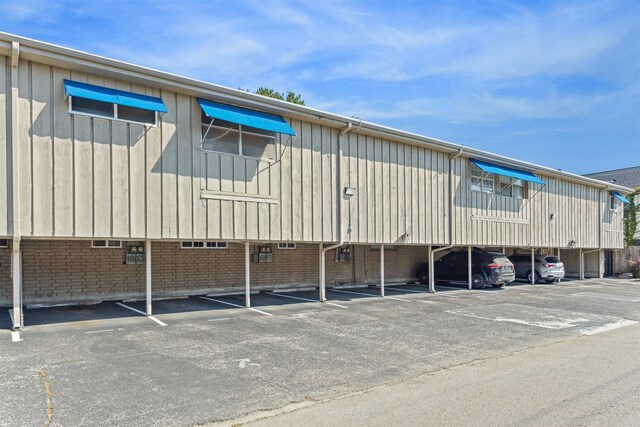 view of vehicle parking with a carport