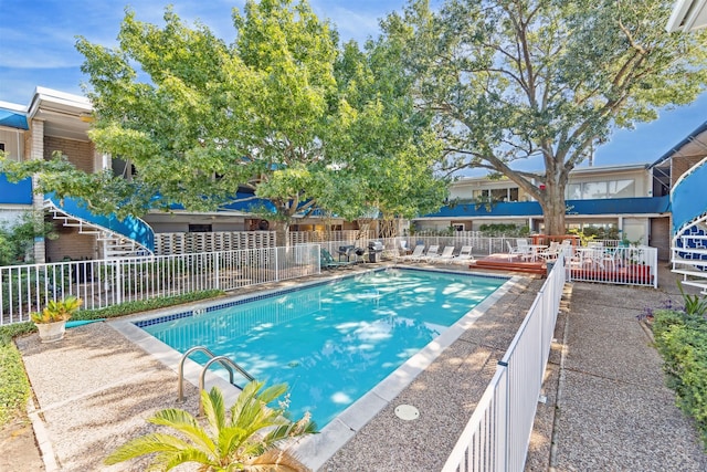 view of swimming pool featuring a patio area