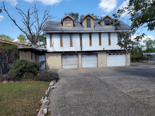 view of front of property with a garage