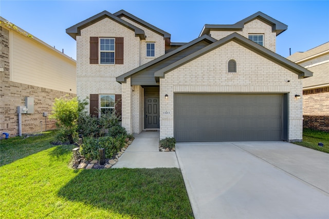 view of front of home with a garage and a front lawn