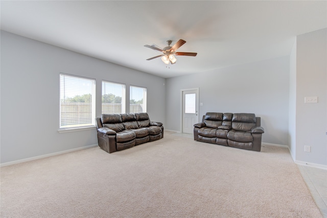 carpeted living room featuring ceiling fan