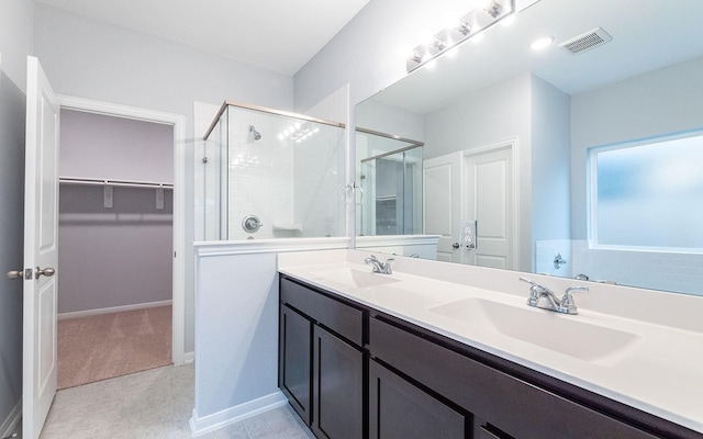 bathroom featuring vanity and an enclosed shower