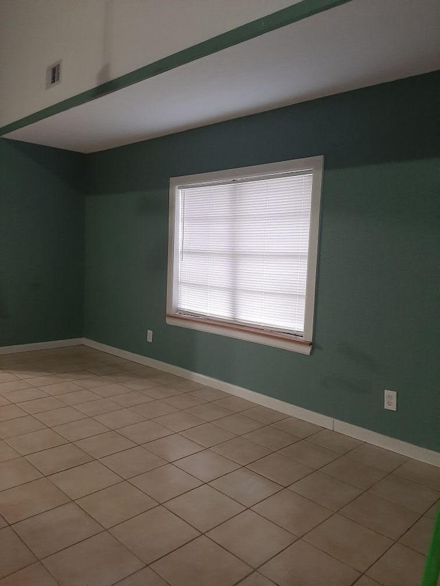 view of tiled spare room