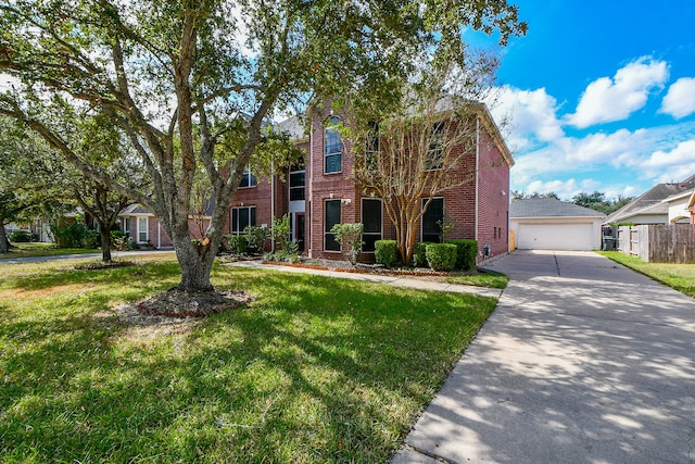 view of front of house with a front lawn and a garage