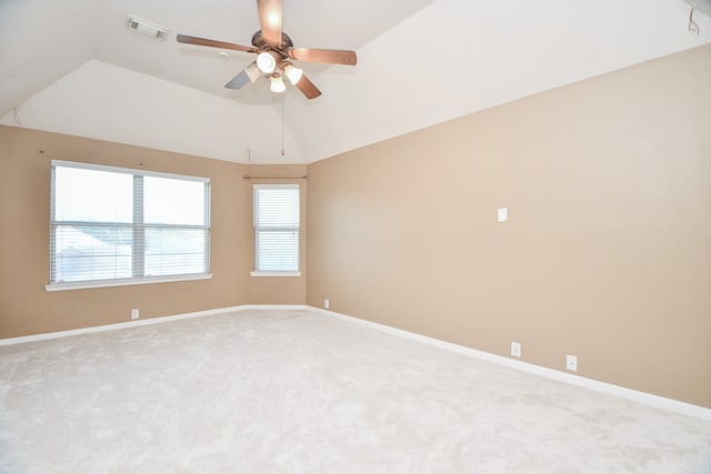 carpeted empty room featuring lofted ceiling and ceiling fan