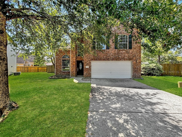 view of front of house featuring central air condition unit, a front yard, and a garage