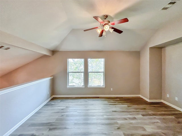 bonus room featuring lofted ceiling with beams, wood-type flooring, and ceiling fan