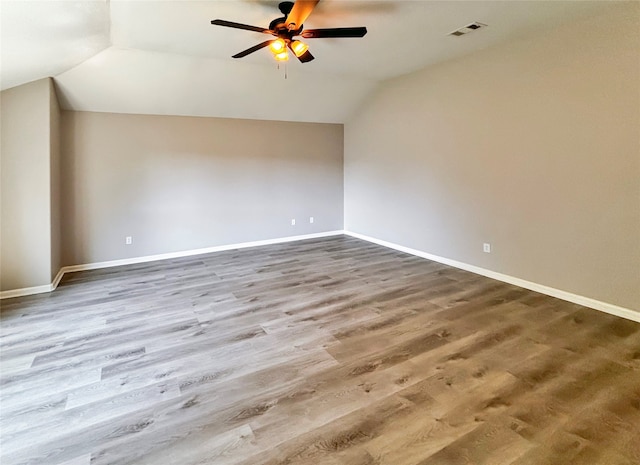 bonus room with ceiling fan, vaulted ceiling, and hardwood / wood-style floors