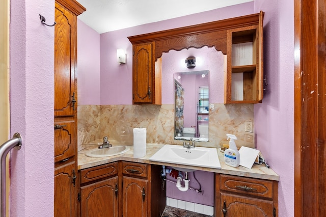 bathroom with vanity and decorative backsplash