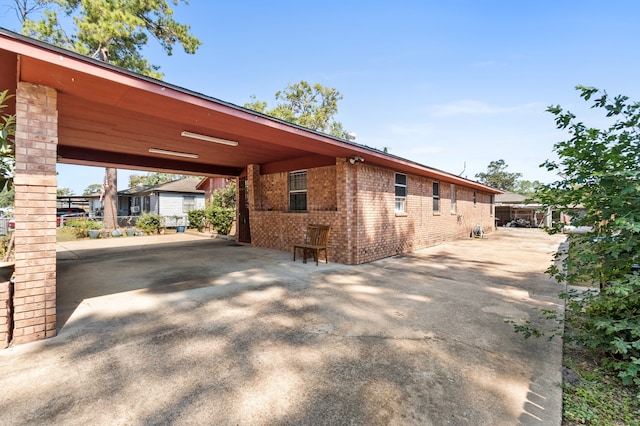 view of property exterior featuring a carport