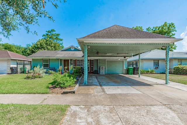 view of front of home with a front yard and a garage