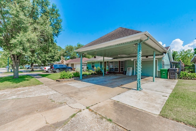 exterior space featuring a garage and a carport