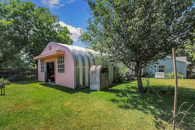 view of outdoor structure featuring a yard