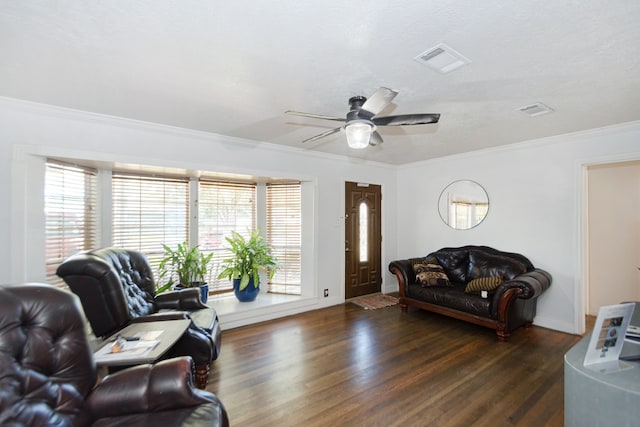 living room with dark hardwood / wood-style flooring, ceiling fan, and ornamental molding