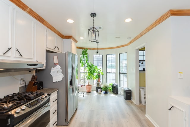 kitchen featuring hanging light fixtures, light hardwood / wood-style flooring, gas range, ornamental molding, and white cabinetry