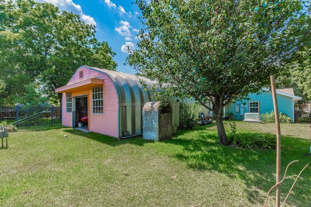 view of outdoor structure featuring a yard