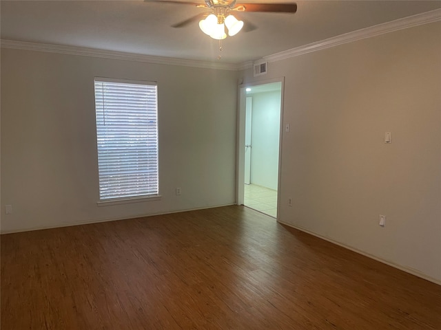 unfurnished room with ornamental molding, hardwood / wood-style flooring, and ceiling fan