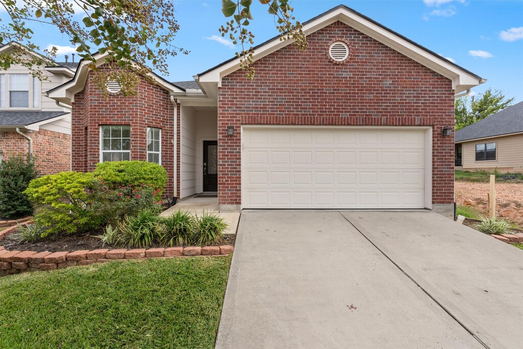 112 Cove Place Ct, Conroe, TX 77356 - view of property with a garage