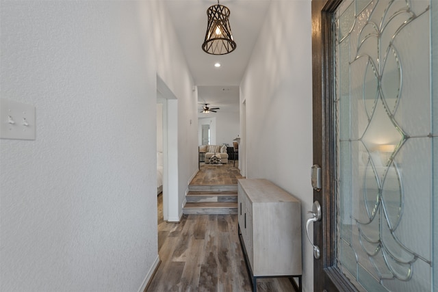 corridor featuring wood-type flooring