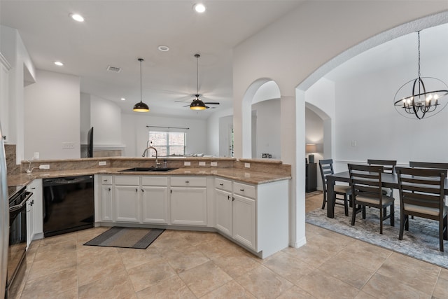 kitchen featuring white cabinetry, black appliances, sink, and decorative light fixtures