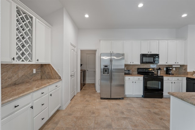 kitchen with tasteful backsplash, black appliances, white cabinets, light stone counters, and light tile patterned floors