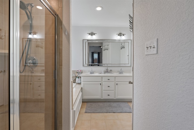 bathroom featuring vanity, tile patterned floors, and a shower with door