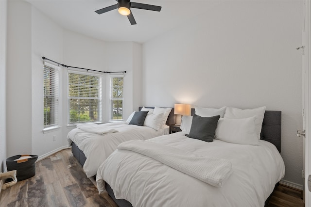 bedroom featuring dark hardwood / wood-style floors and ceiling fan