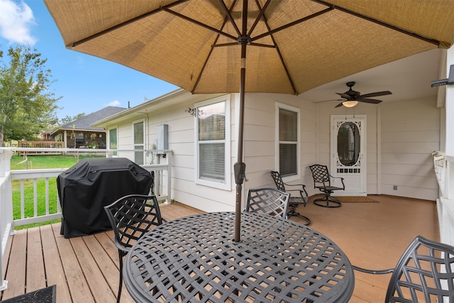 wooden deck featuring ceiling fan and grilling area