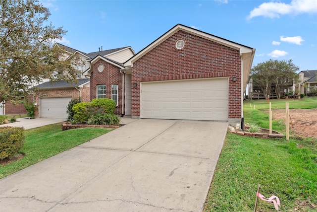 front facade featuring a front yard and a garage