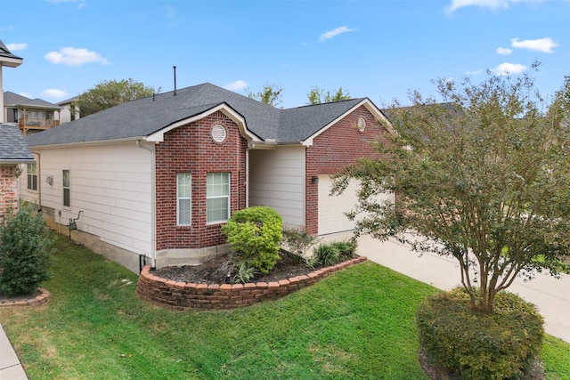 view of front of property with a garage and a front lawn