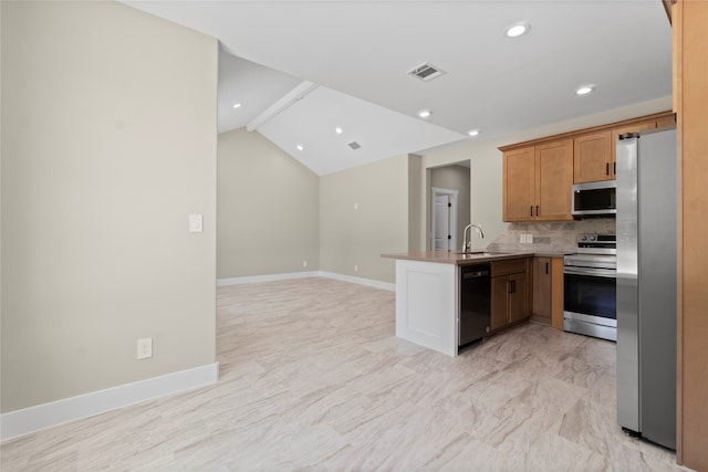 kitchen with kitchen peninsula, decorative backsplash, lofted ceiling, appliances with stainless steel finishes, and sink