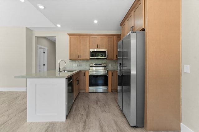 kitchen featuring decorative backsplash, sink, appliances with stainless steel finishes, and kitchen peninsula