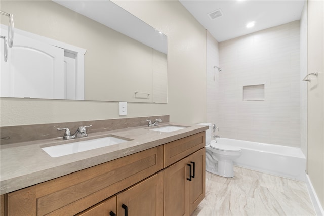 full bathroom with vanity, toilet, and tiled shower / bath