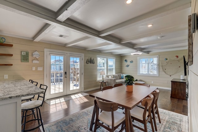 22819 Vida St, Galveston, TX 77554 - dining room with french doors, hardwood / wood-style floors, wooden walls, beamed ceiling, and recessed lighting