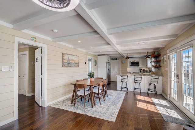 22819 Vida St, Galveston, TX 77554 - dining area featuring wood walls, dark wood-style floors, beamed ceiling, and recessed lighting