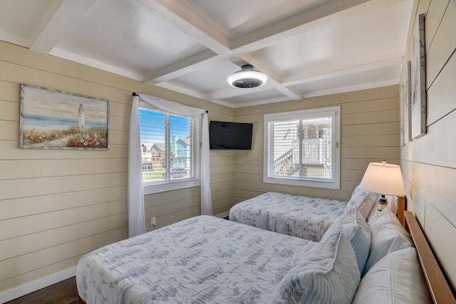 22819 Vida St, Galveston, TX 77554 - bedroom featuring wood walls, dark wood finished floors, multiple windows, beamed ceiling, and coffered ceiling