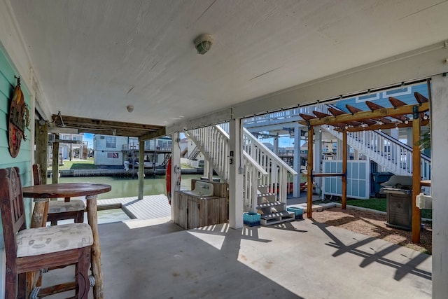 22819 Vida St, Galveston, TX 77554 - view of patio / terrace featuring stairway and a water view