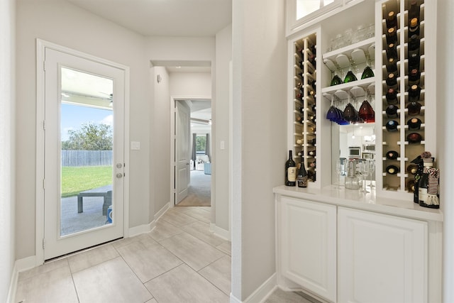 wine room with light tile patterned floors