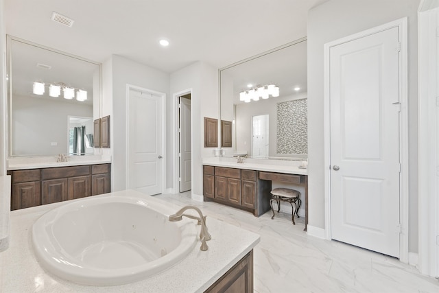 bathroom featuring vanity and a tub to relax in