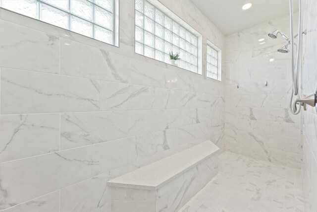 bathroom with a tile shower