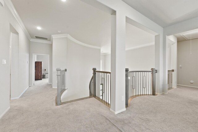 hallway featuring light carpet and ornamental molding