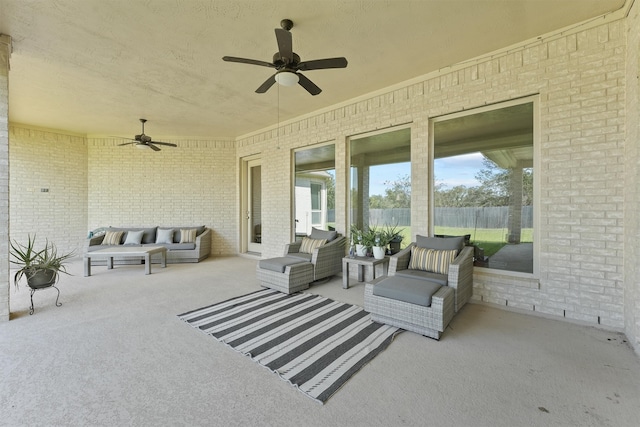 view of patio / terrace with an outdoor living space and ceiling fan