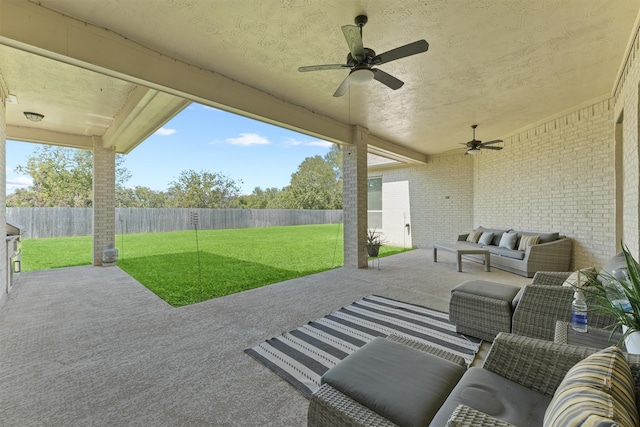 view of patio / terrace with an outdoor living space and ceiling fan