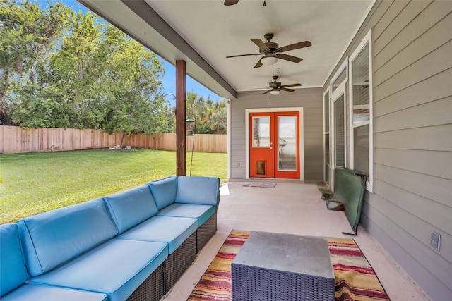 unfurnished sunroom with ceiling fan