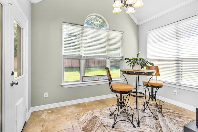 tiled dining space featuring a chandelier, lofted ceiling, and crown molding