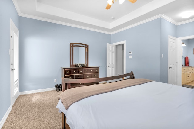 bedroom featuring carpet flooring, ensuite bathroom, ceiling fan, and crown molding