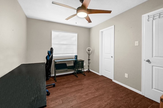 office area featuring dark hardwood / wood-style floors and ceiling fan