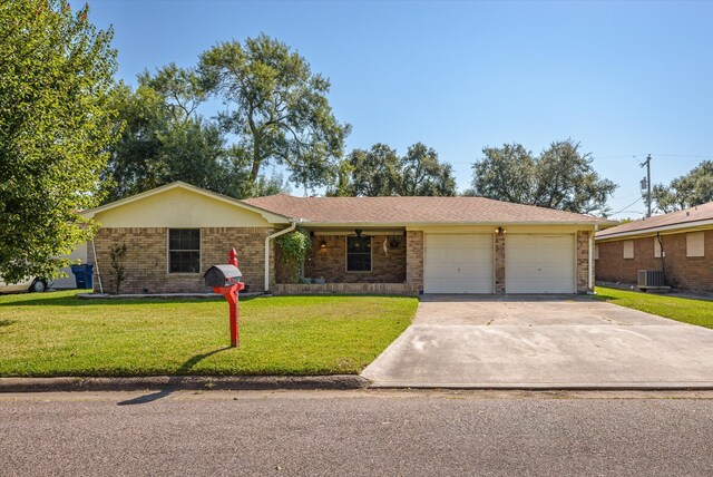 single story home featuring a front yard and a garage